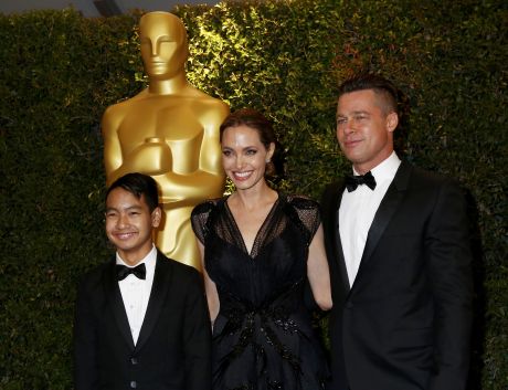 Angelina Jolie and partner Brad Pitt and son Maddox arrive at the 5th Annual Academy of Motion Picture Arts and Sciences Governors Awards in Hollywood