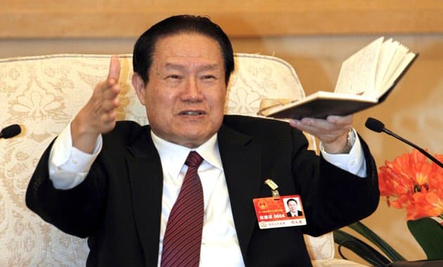 File photo of China's former Politburo Standing Committee Member Zhou Yongkang gesturing as he speaks at group discussion during National People's Congress in Beijing